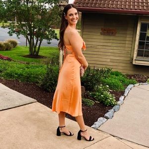 Beautiful orange backless dress.